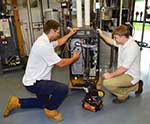 Students Looking At Machinery